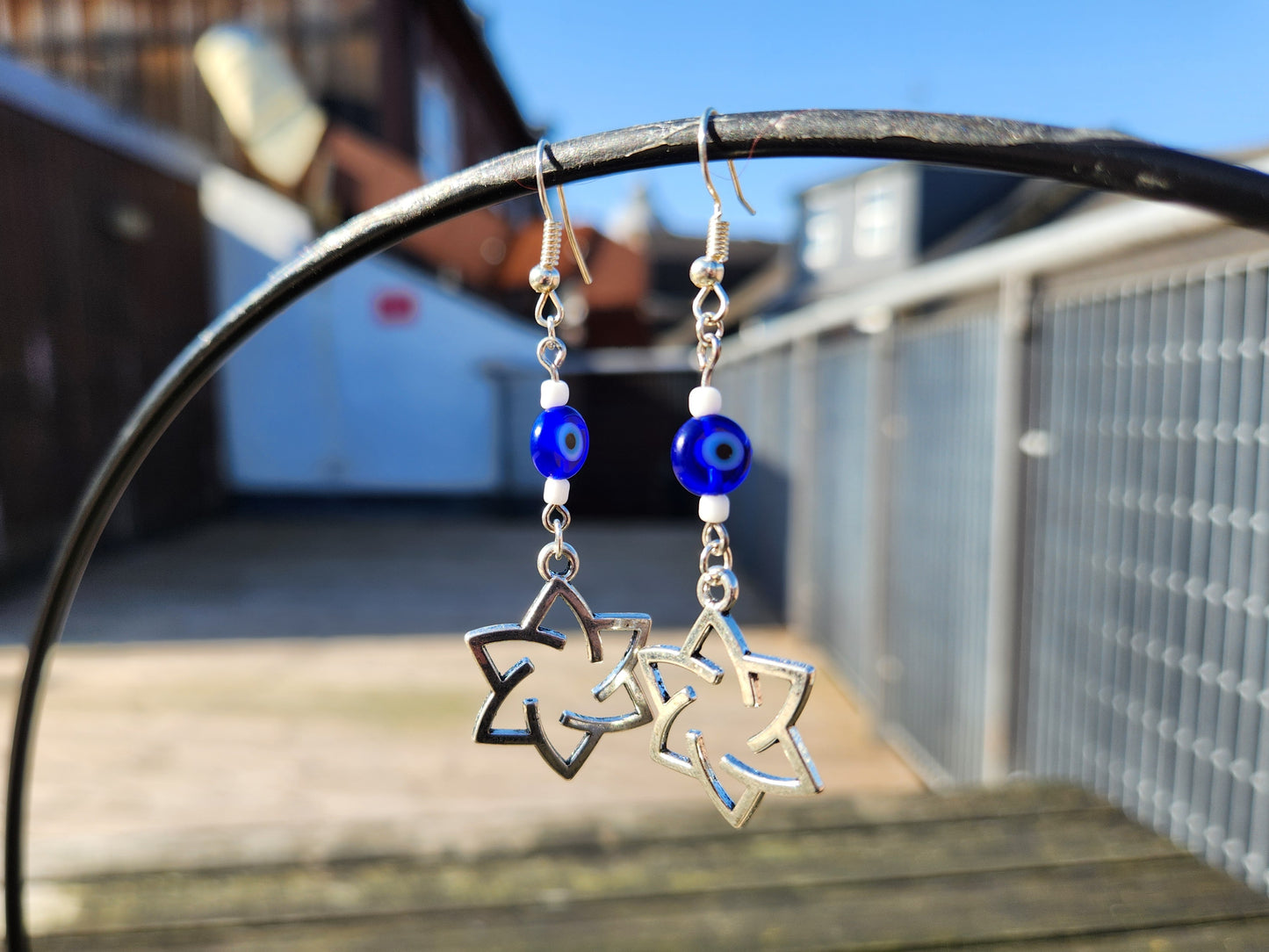 blue evil eye and white bead silver star of david earrings