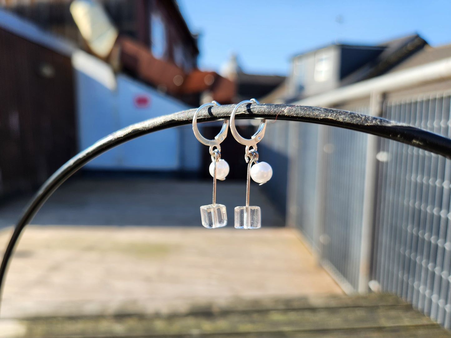 white and clear beaded silver huggie earrings