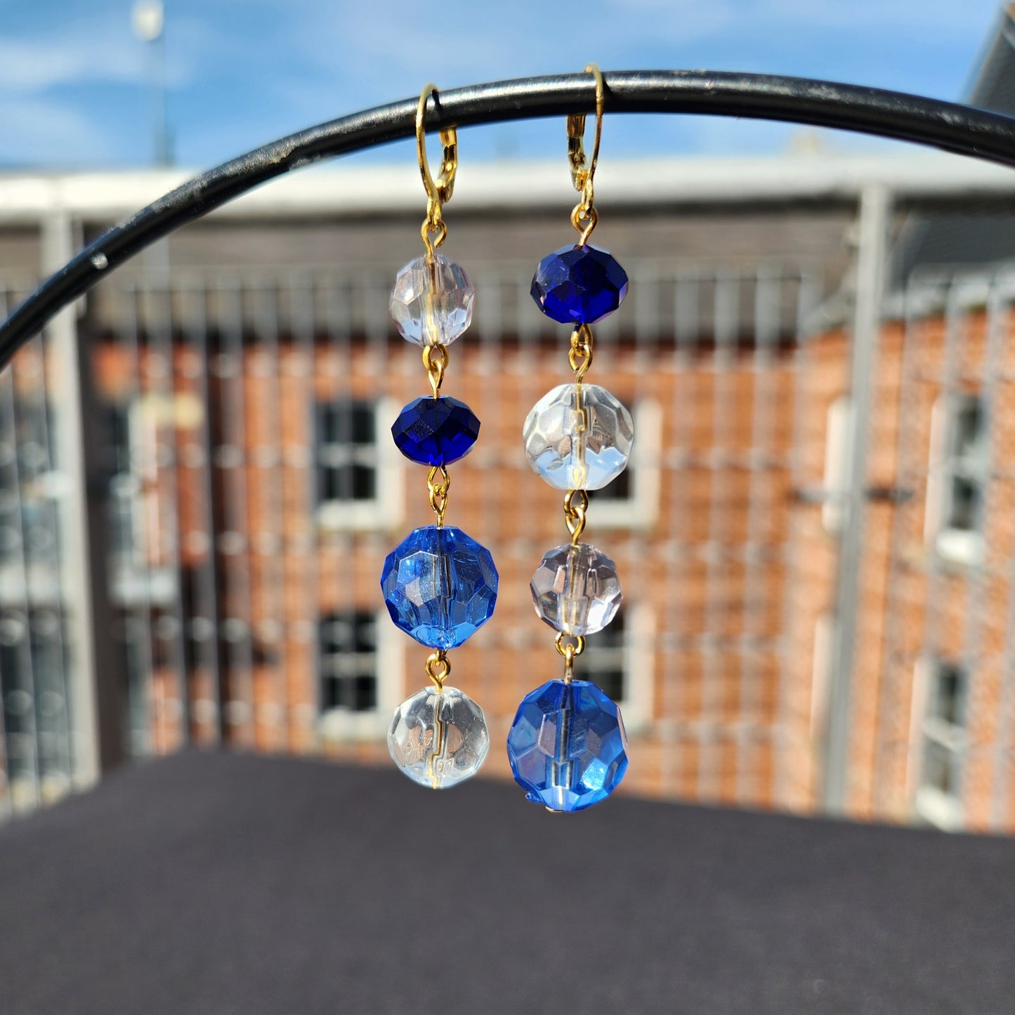 asymmetric blue and clear bead gold huggie earrings