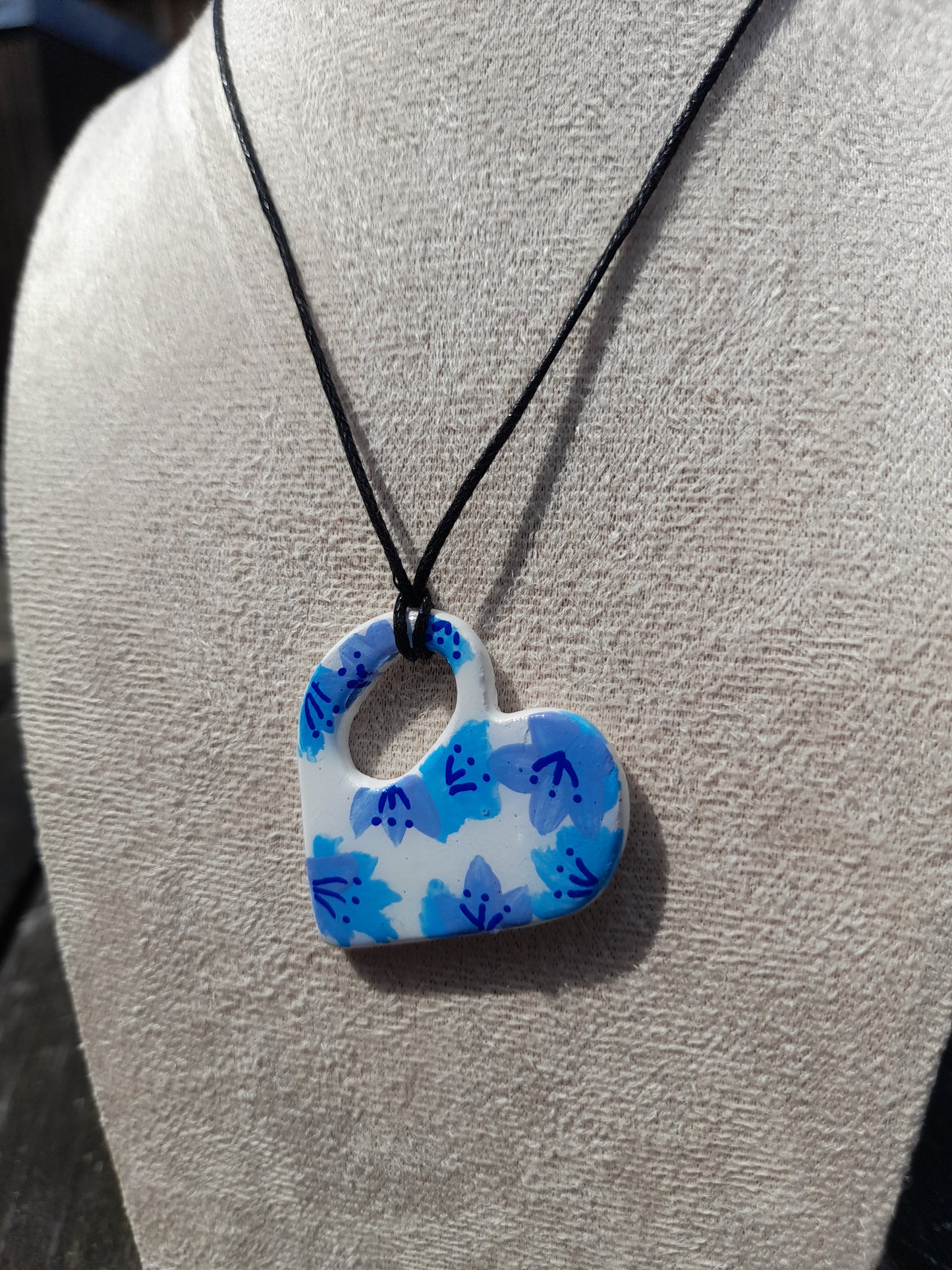 blue painted flowers heart necklace