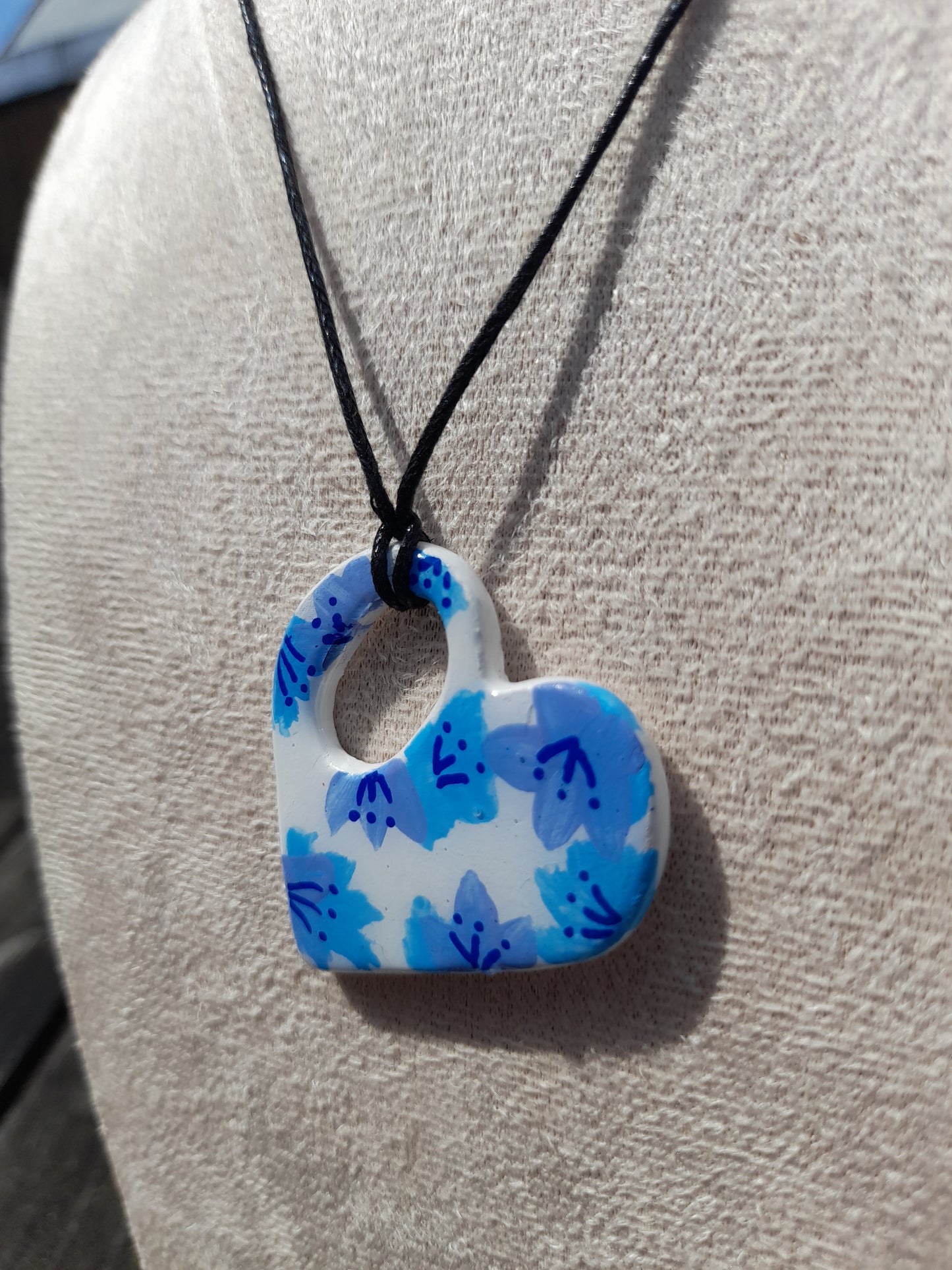 blue painted flowers heart necklace