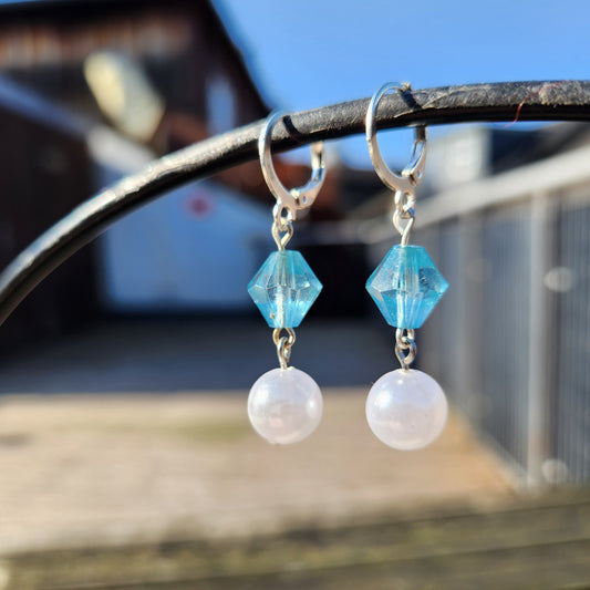 white and blue beaded silver dangle huggie earrings