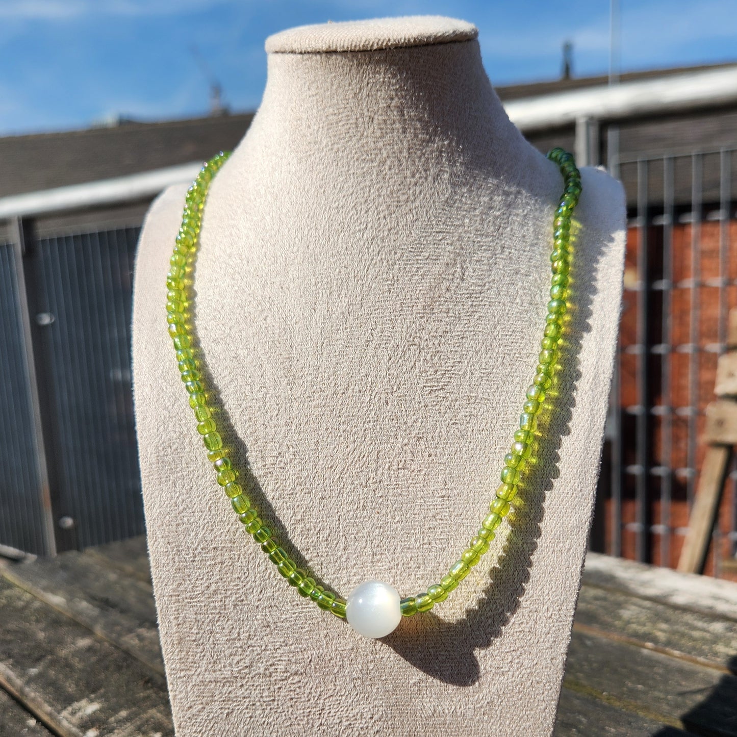 green and white pearlescent glass beaded necklace