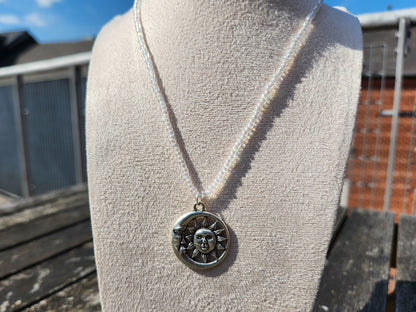 silver celestial pendant iridescent glass bead necklace