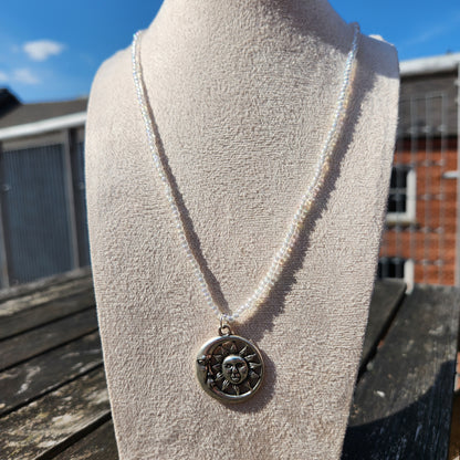 silver celestial pendant iridescent glass bead necklace