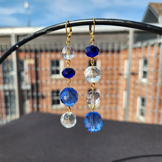 asymmetric blue and clear bead gold huggie earrings