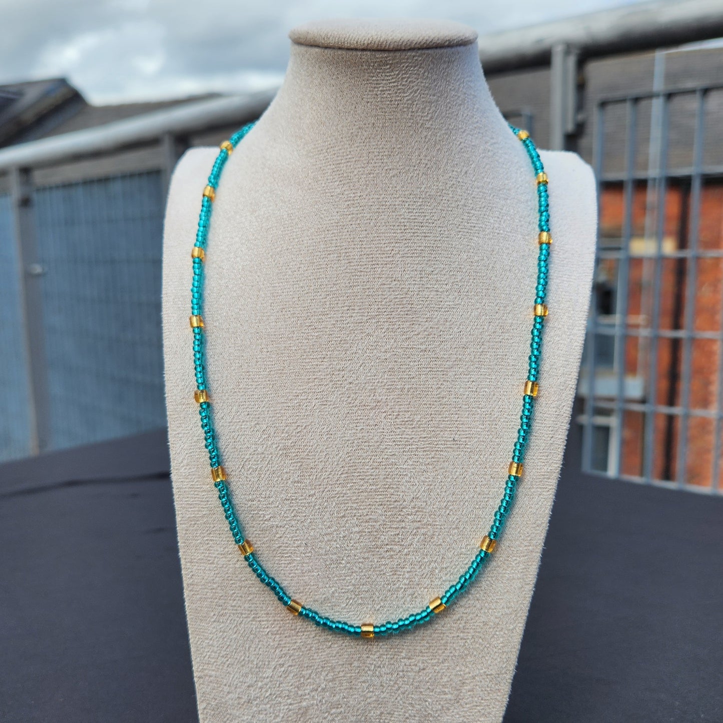 blue and gold glass beaded necklace