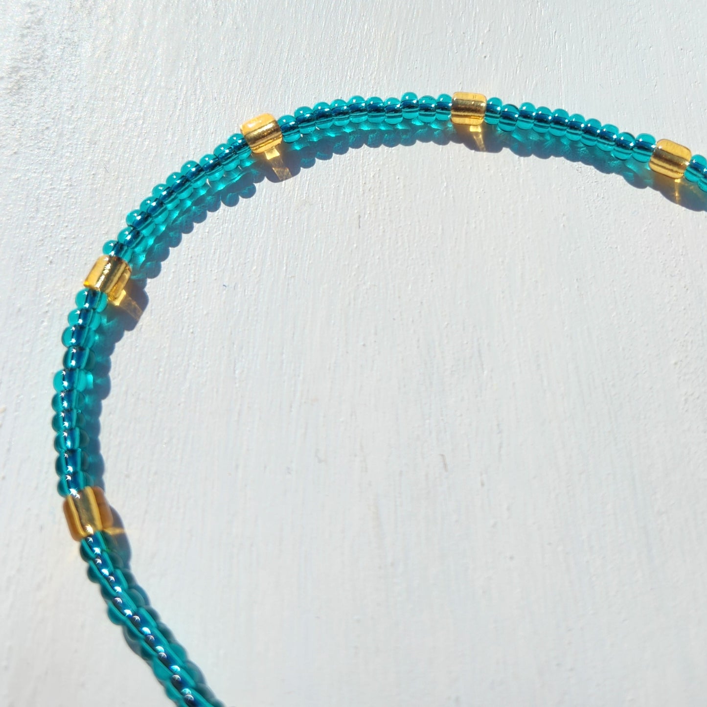 blue and gold glass beaded necklace
